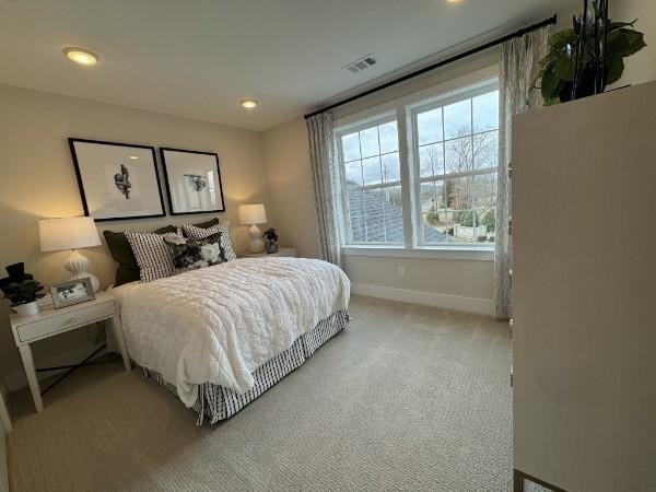 bedroom with recessed lighting, carpet, visible vents, and baseboards