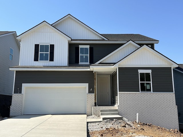 view of front facade featuring an attached garage, board and batten siding, concrete driveway, and brick siding