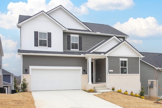 view of front of house with board and batten siding, a garage, brick siding, and driveway