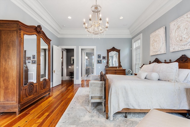 bedroom with baseboards, crown molding, an inviting chandelier, and wood finished floors