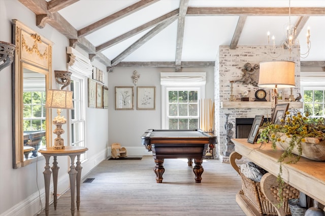 game room with lofted ceiling with beams, baseboards, visible vents, and light wood-style floors