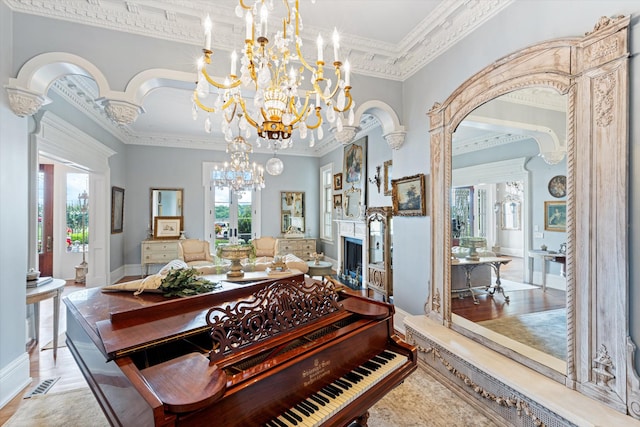 dining room featuring arched walkways, a fireplace, visible vents, and a healthy amount of sunlight