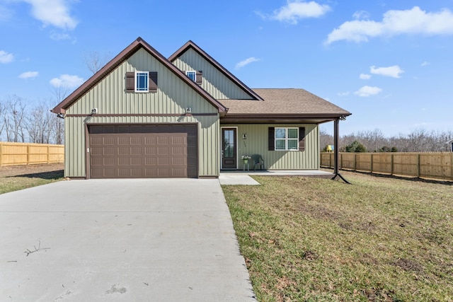 view of front of home with a garage, fence, concrete driveway, roof with shingles, and a front yard