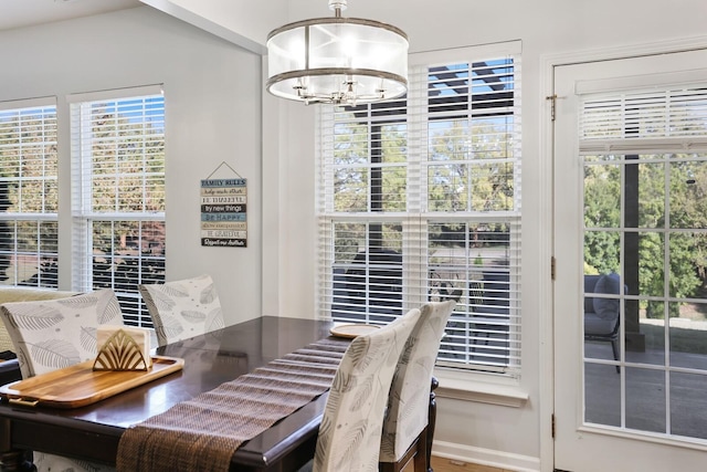 dining space featuring an inviting chandelier