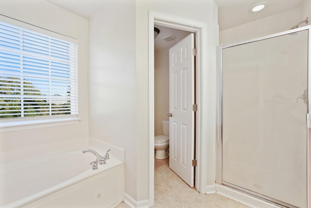 bathroom featuring visible vents, toilet, a shower stall, tile patterned flooring, and a bath