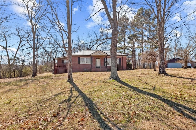 view of front of house with brick siding, crawl space, a chimney, and a front lawn