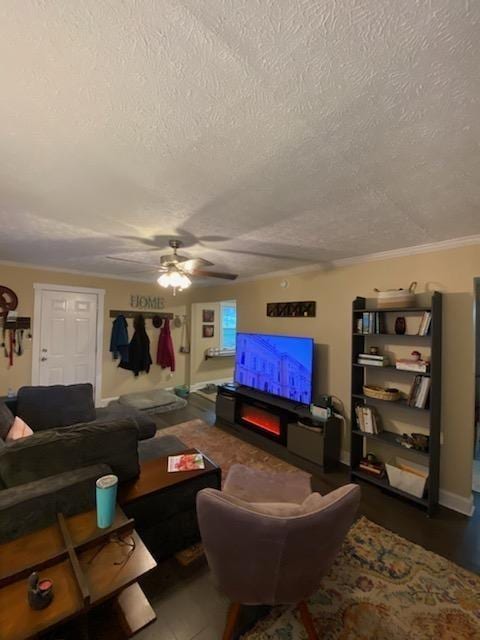 living area featuring a textured ceiling and a ceiling fan