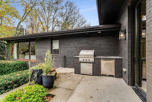 view of patio with exterior kitchen and grilling area