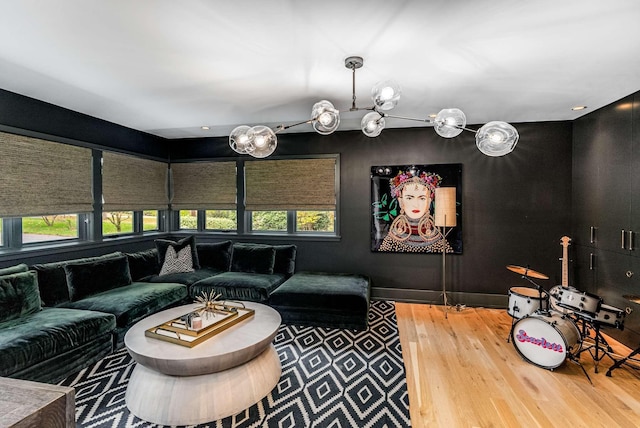 cinema room featuring a healthy amount of sunlight and wood finished floors