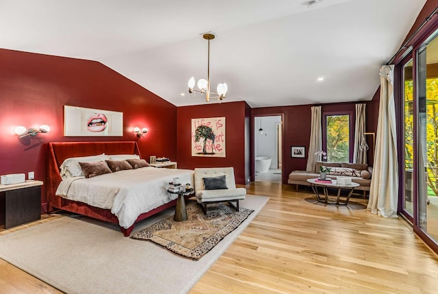 bedroom with vaulted ceiling, access to outside, wood finished floors, and a notable chandelier