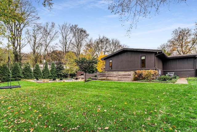 view of home's exterior with a yard