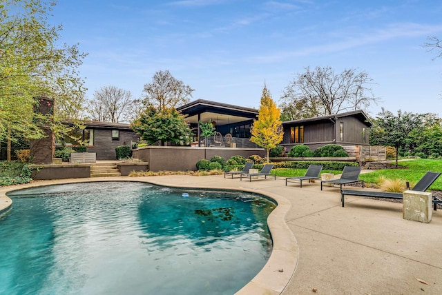 pool with a patio area