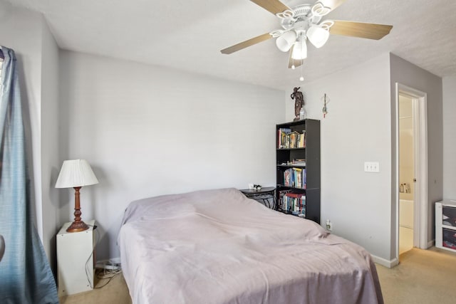 bedroom featuring ceiling fan, baseboards, and light colored carpet