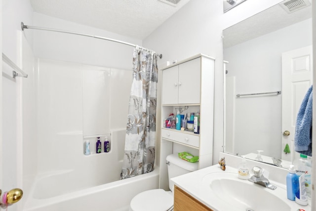 bathroom featuring shower / bath combo, visible vents, toilet, a textured ceiling, and vanity