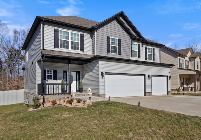 view of front of home with a garage, driveway, a porch, fence, and a front lawn