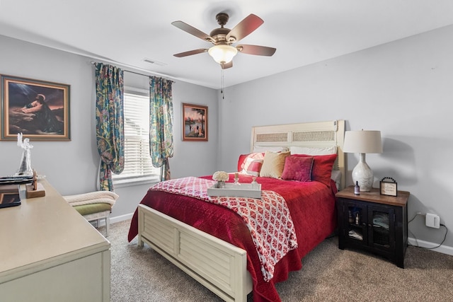 bedroom featuring ceiling fan, carpet, visible vents, and baseboards