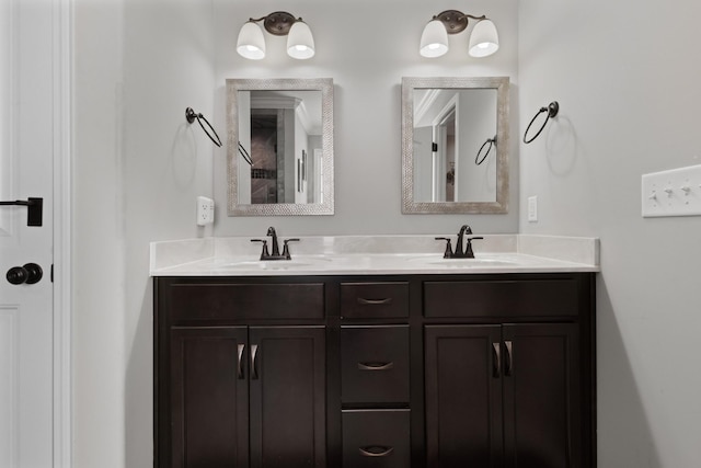 full bathroom with double vanity and a sink