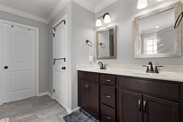 full bathroom featuring crown molding, a sink, and double vanity