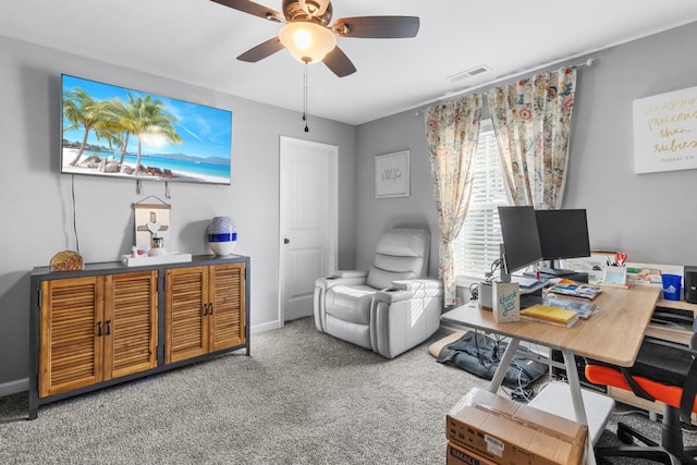 home office featuring carpet flooring, ceiling fan, visible vents, and baseboards