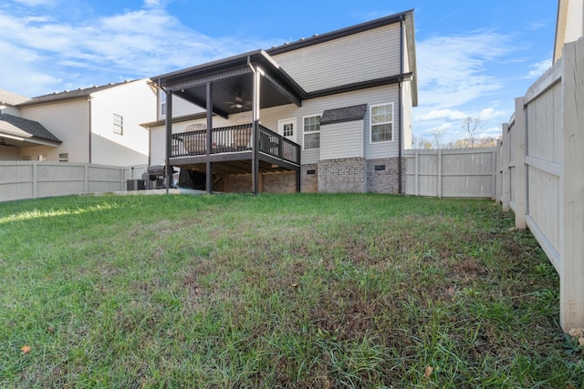 rear view of property with a fenced backyard, a deck, central AC, and a yard