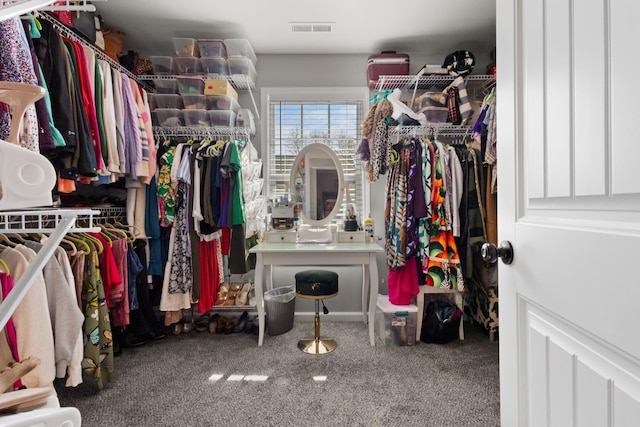 walk in closet with carpet floors and visible vents