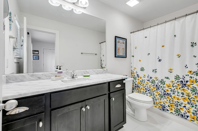 bathroom featuring curtained shower, vanity, and toilet