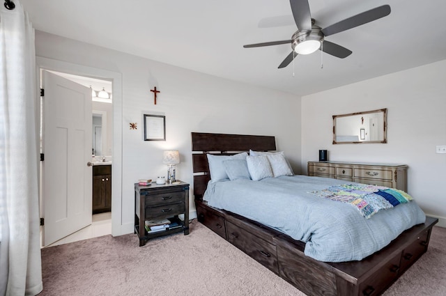 bedroom featuring carpet floors, connected bathroom, and a ceiling fan