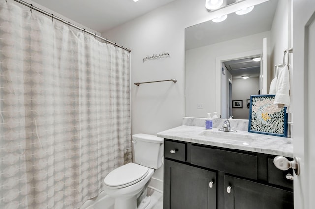 bathroom featuring toilet and vanity