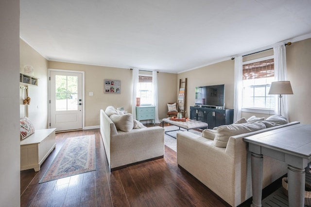 living area with ornamental molding, dark wood-style flooring, and baseboards