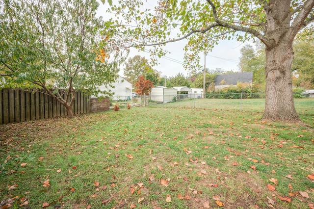 view of yard with a fenced backyard