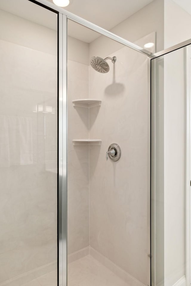 full bathroom with a shower stall