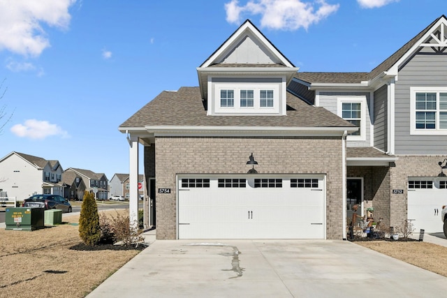 view of front facade featuring a residential view, brick siding, driveway, and roof with shingles