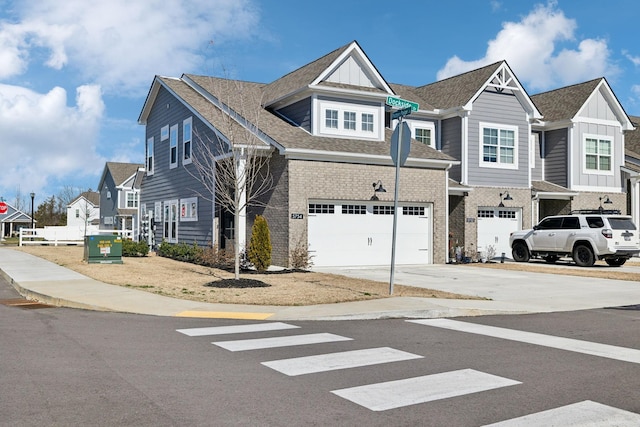 view of front facade with brick siding, driveway, roof with shingles, a residential view, and board and batten siding