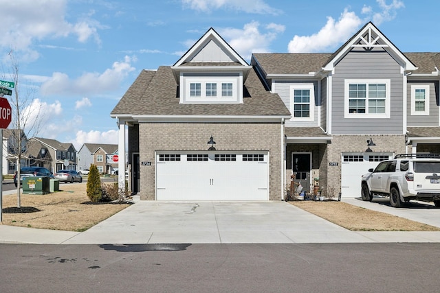 view of front of home with driveway, brick siding, roof with shingles, and a residential view