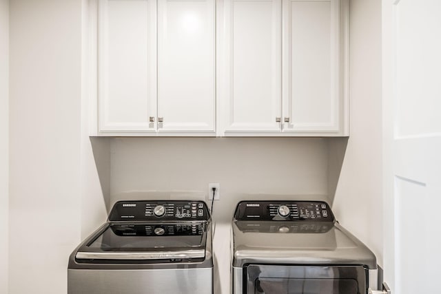 laundry room with washer and dryer and cabinet space