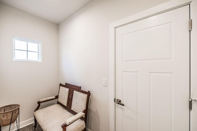 living area featuring baseboards