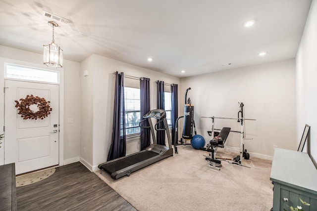 workout room featuring dark wood-style floors, baseboards, visible vents, and recessed lighting