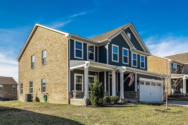 craftsman inspired home with driveway, covered porch, central air condition unit, and a front yard