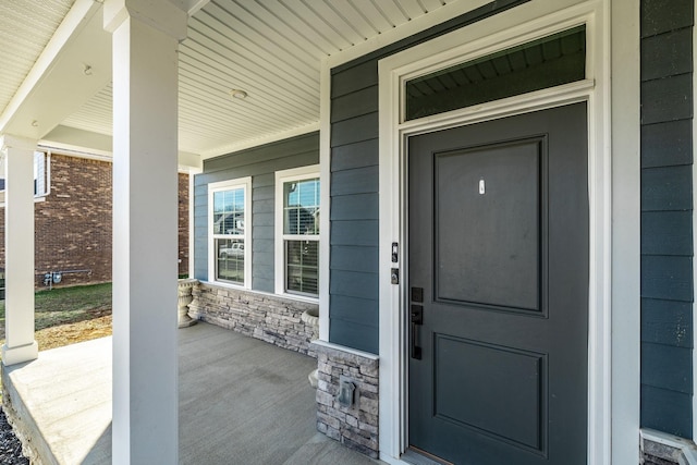 view of exterior entry with stone siding