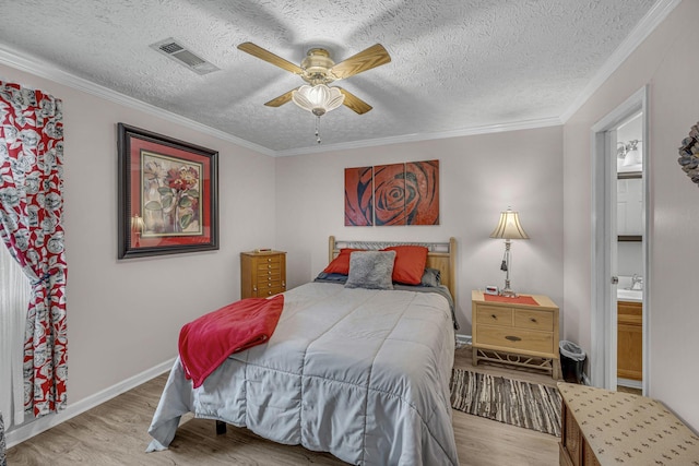 bedroom featuring visible vents, crown molding, a textured ceiling, and wood finished floors