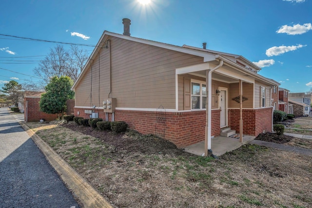 view of home's exterior with brick siding