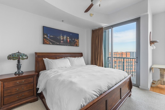 bedroom featuring light carpet, access to outside, baseboards, and a ceiling fan