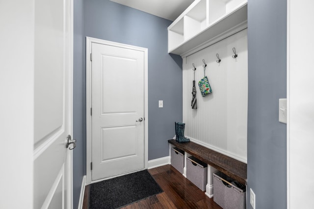 mudroom featuring dark wood-style floors and baseboards