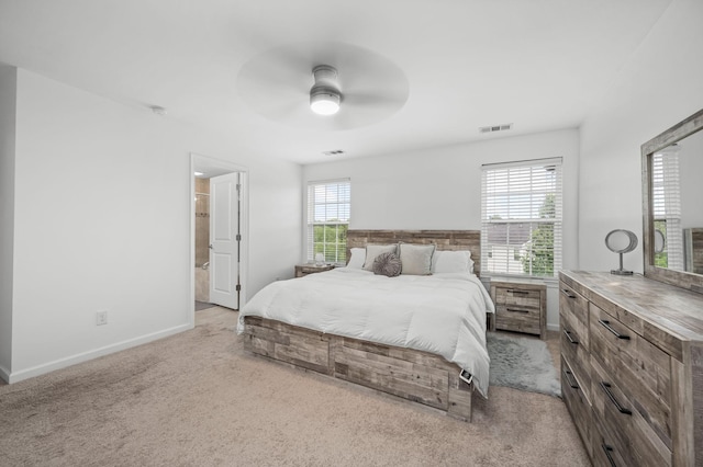 bedroom with light carpet, a ceiling fan, visible vents, and baseboards