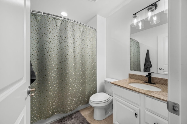 full bathroom featuring toilet, tile patterned flooring, and vanity