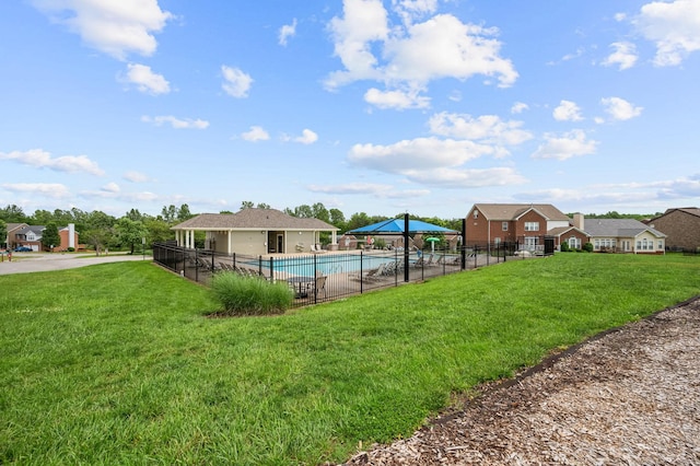 view of yard featuring a community pool, fence, and a gazebo