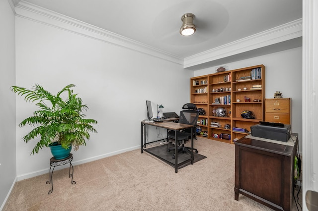 office area with light carpet, ceiling fan, baseboards, and crown molding