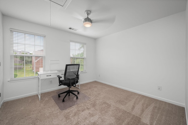 home office with attic access, visible vents, baseboards, and light colored carpet