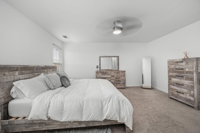 bedroom with carpet, visible vents, ceiling fan, and baseboards