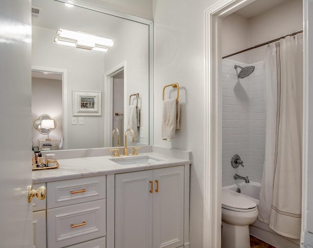 bathroom featuring visible vents, toilet, shower / bath combination with curtain, and vanity